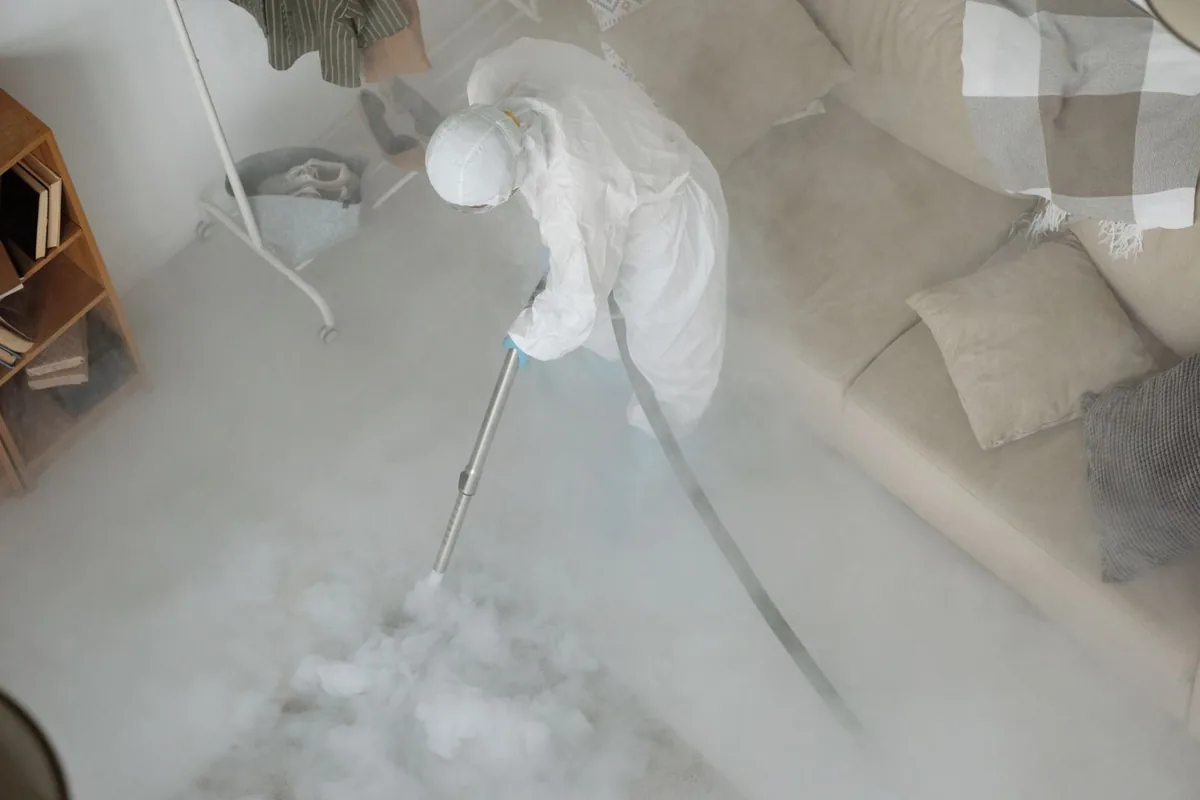 Biohazard cleanup technician in protective equipment, Rothsville, PA